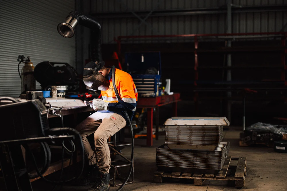 An engineer working at a workshop bench