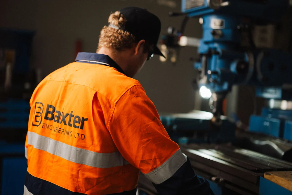 Baxter engineer working with machinery in the Auckland workshop